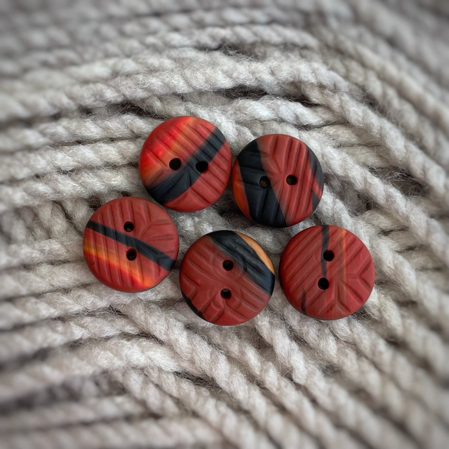 Small ~12mm Red, orange and black polymer clay buttons with impression - set of 5